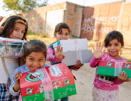 Children receiving Operation Christmas Child boxes